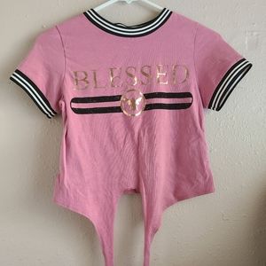 Small pink shirt with 'BLESSED' in front '